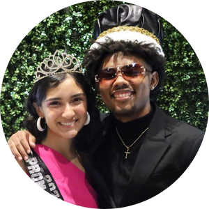 teen couple wearing crowns